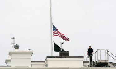 An American flag flies at half-staff at the White House on May 24